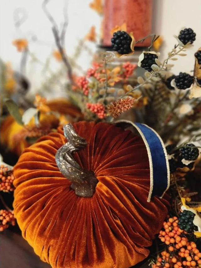 Copper velvet pumpkin with navy ribbon and berries