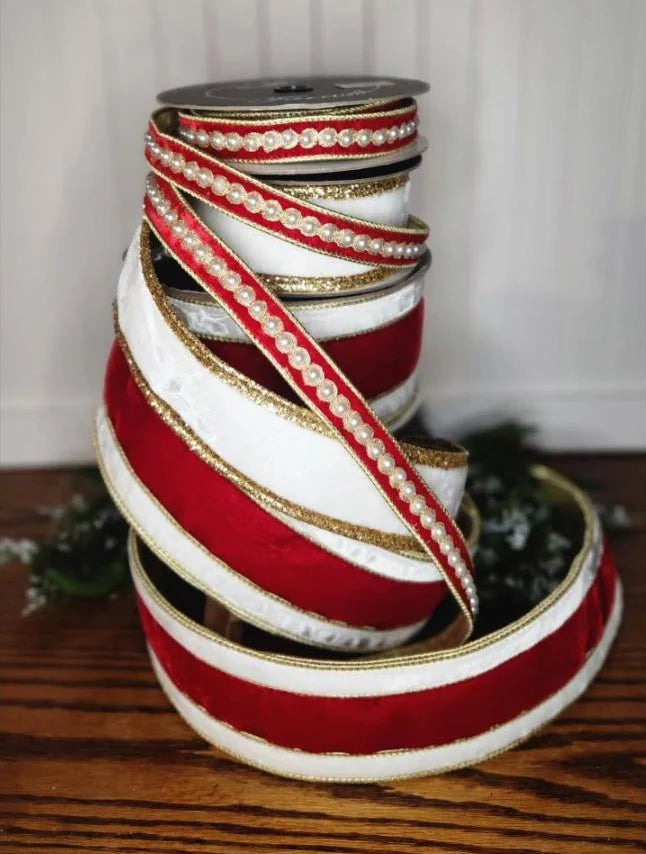 Red velvet and pearl border ribbons on a wooden table