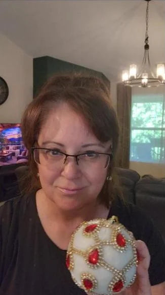 Rachel holding a jeweled velvet ornament